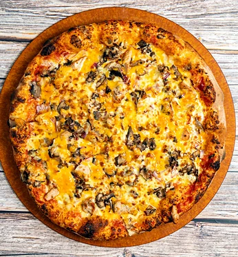 Grilled chicken pizza on a wooden board