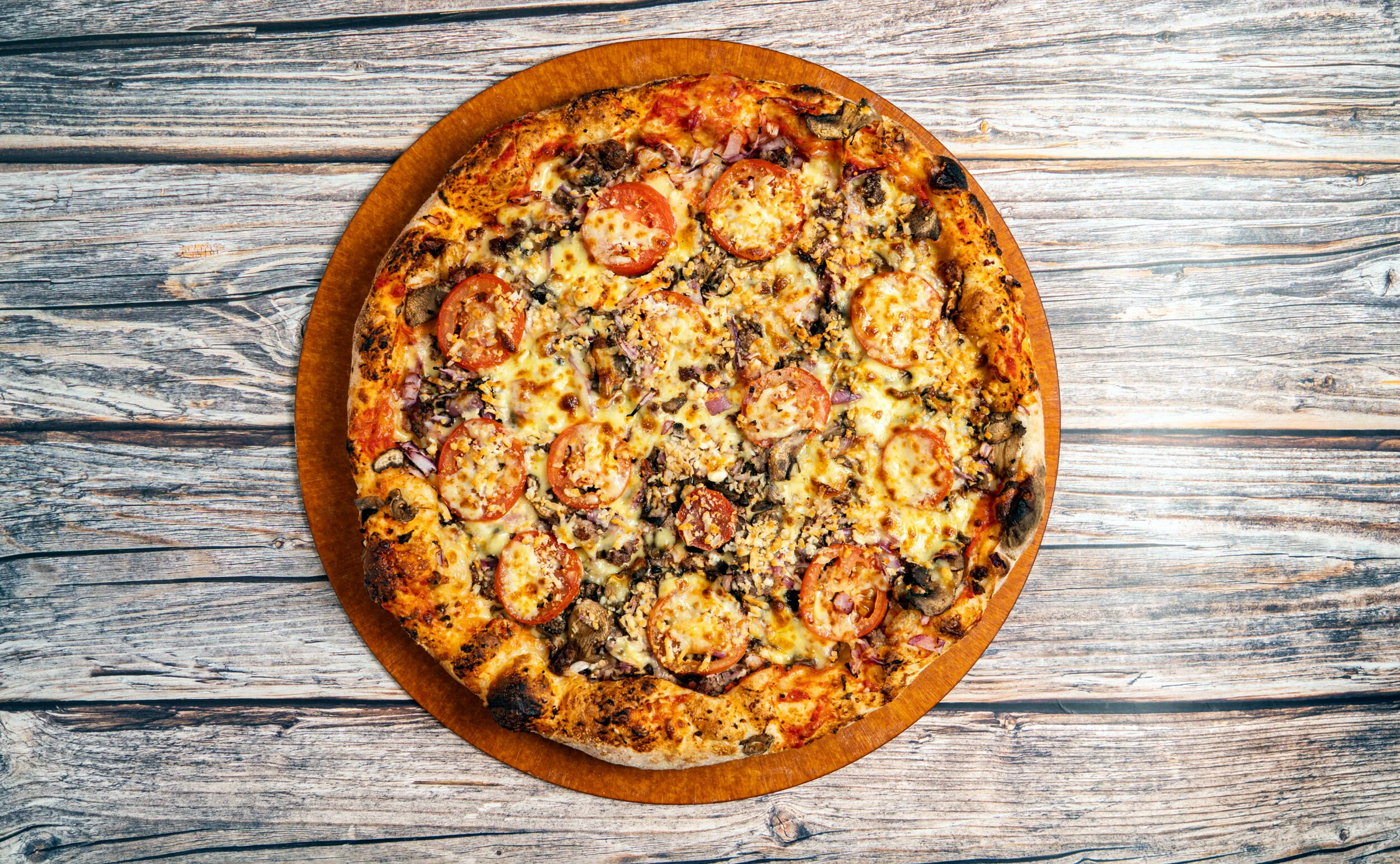 Authentic pizza on a wooden table