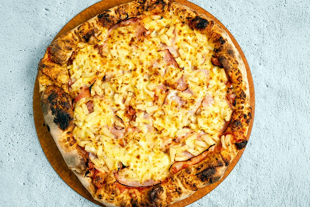 Hawaiian pizza with ham and pineapple
